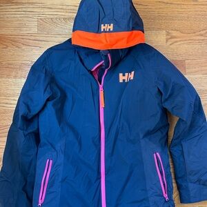 Girls Helly Hanson Ski Jacket - Navy outer, pink lining.